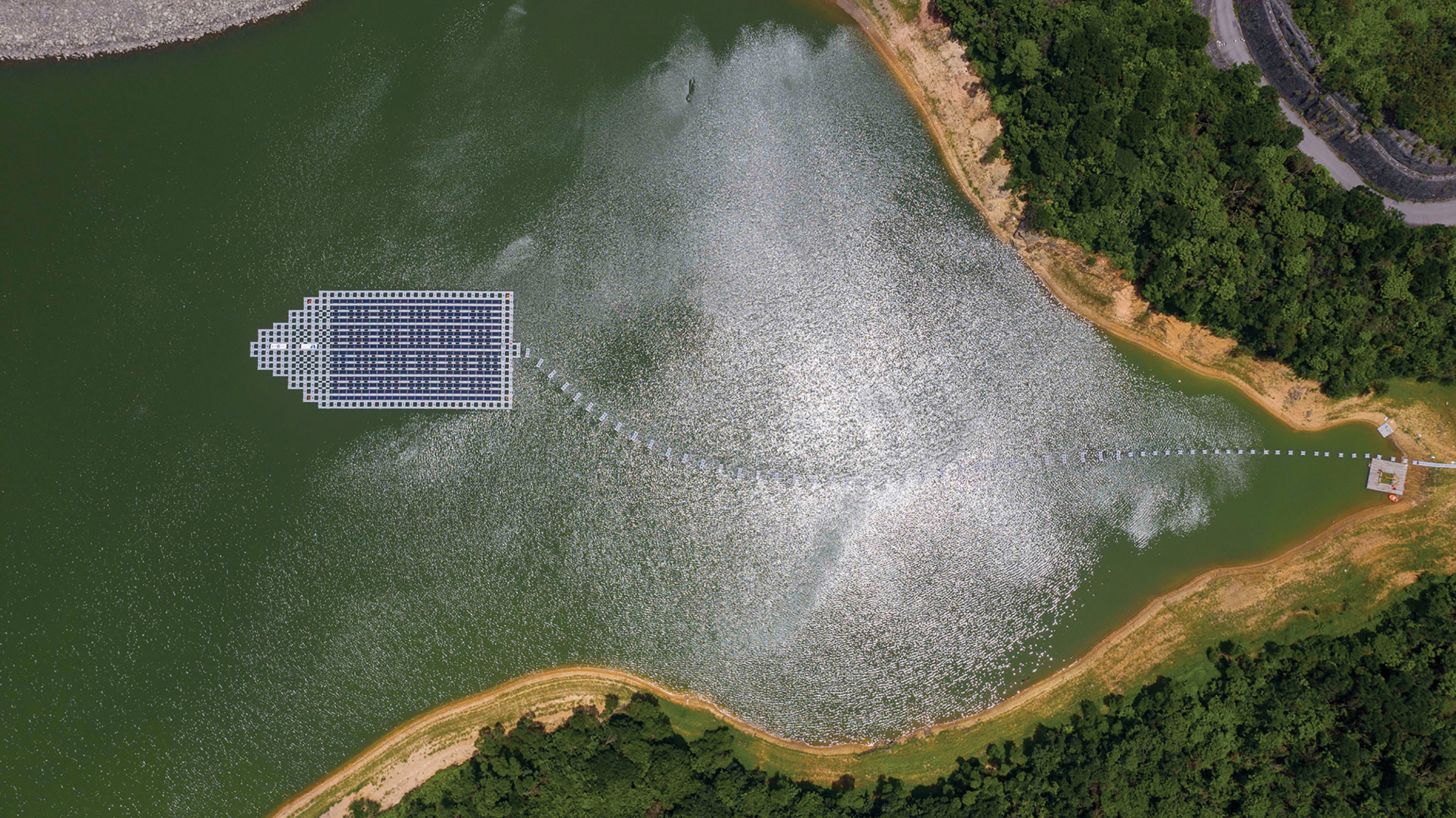 The floating solar power system at the Plover Cove Reservoir has solar PV panels shaped like a boat.
