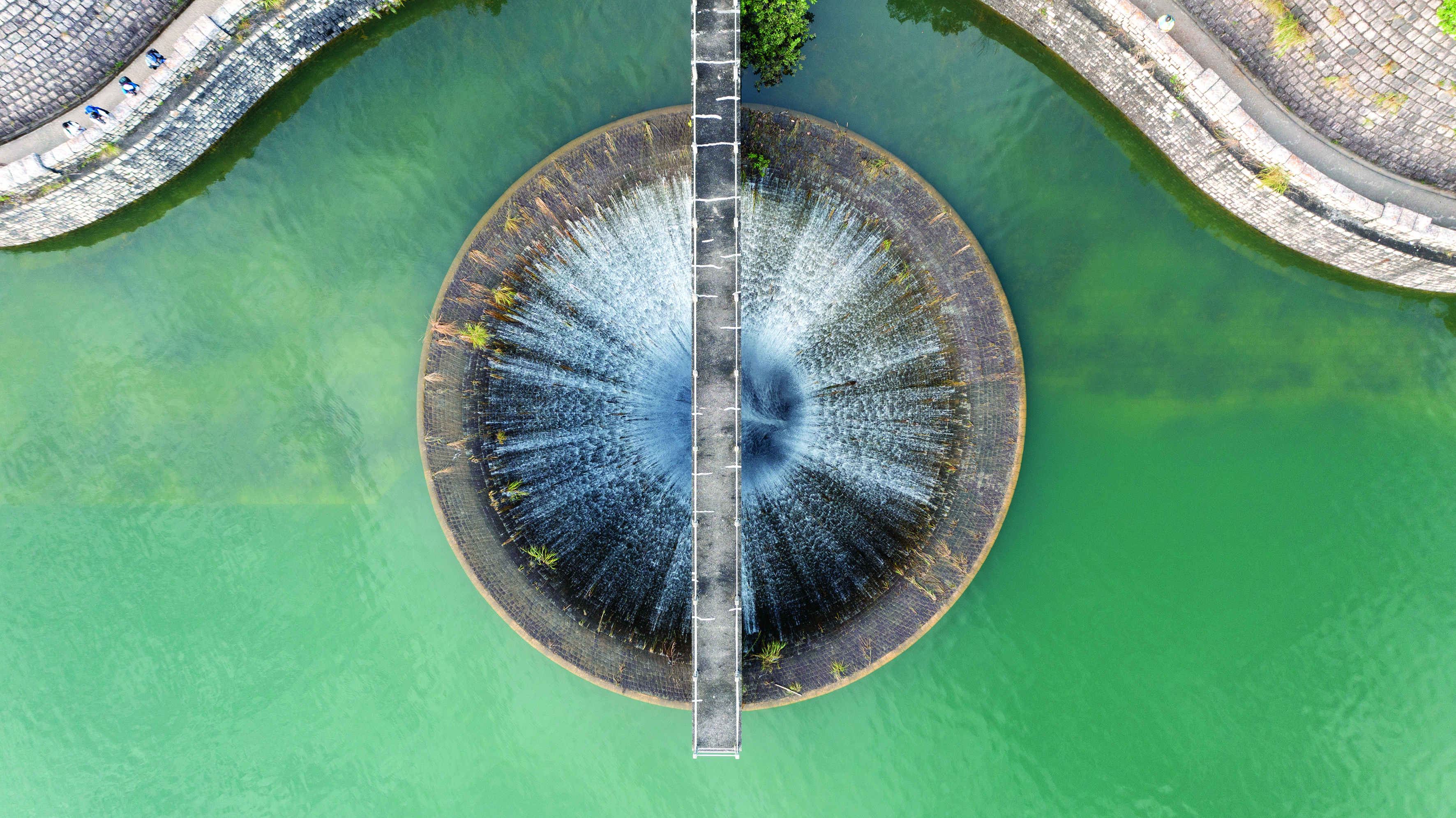 Aerial view of the bellmouth spillway at the Shing Mun Reservoir