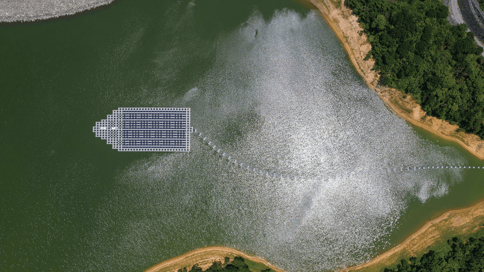 The floating solar power system at the Plover Cove Reservoir has solar PV panels shaped like a boat.