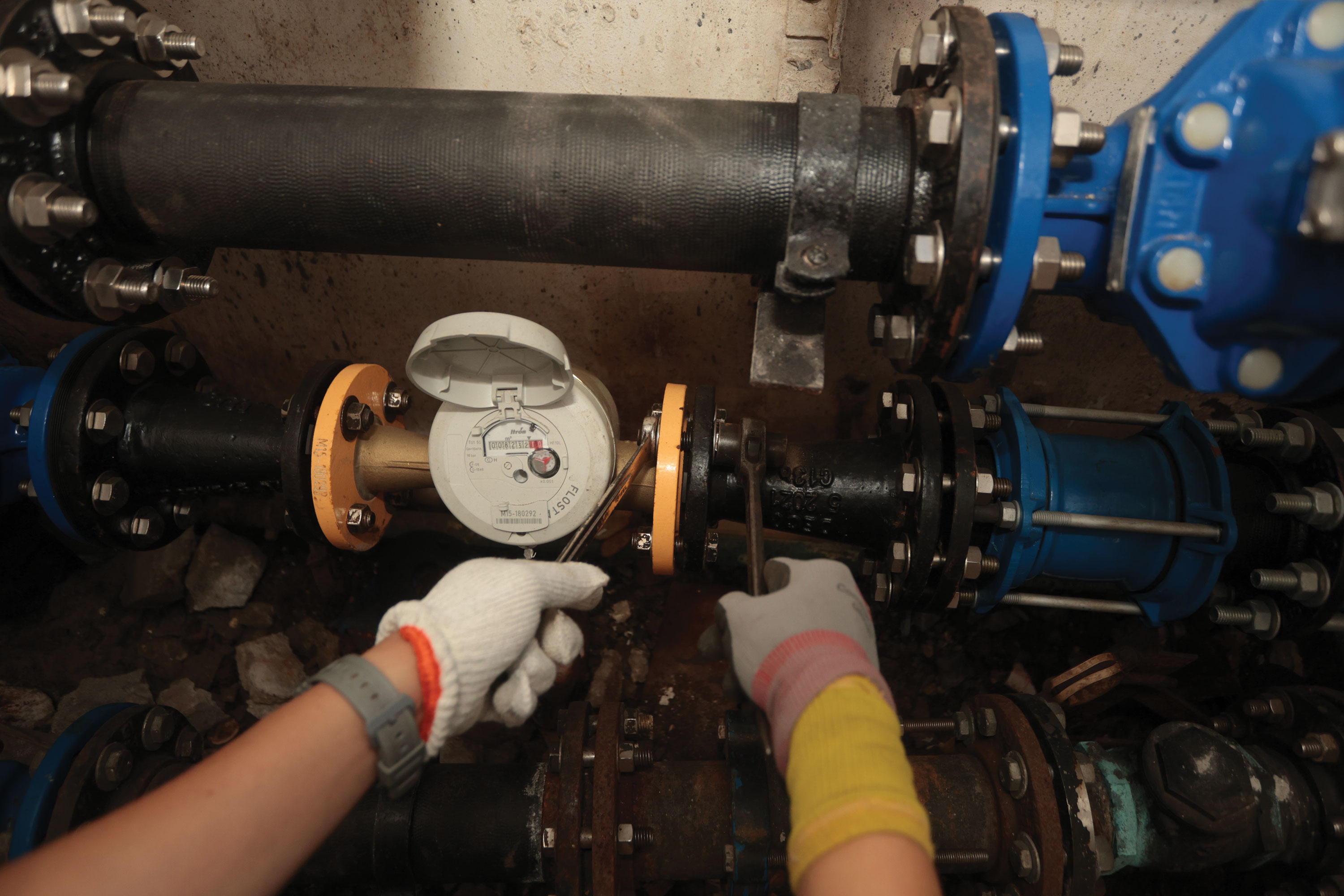 Waterworks staff installing water meter