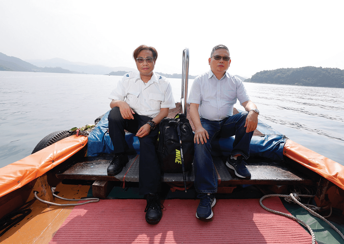 Meter Reader HO Tak-chiu (left) and Senior Meter Reader TSANG Chi-kai (right) have travelled all over Hong Kong for meter reading.