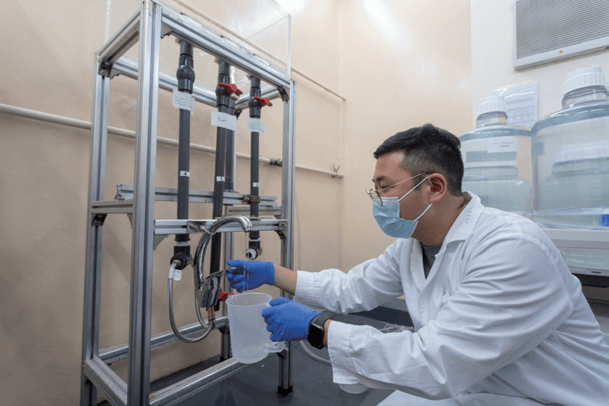 Laboratory staff tests the quality of water from a registered tap