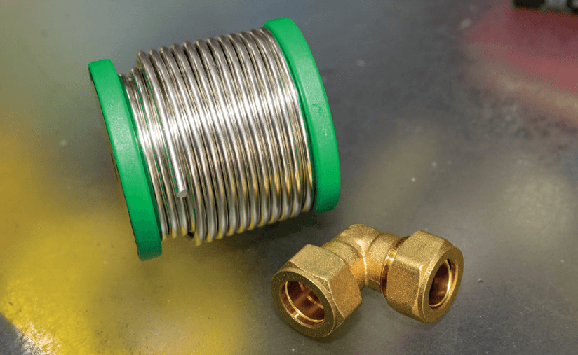 Soldering material and copper elbow