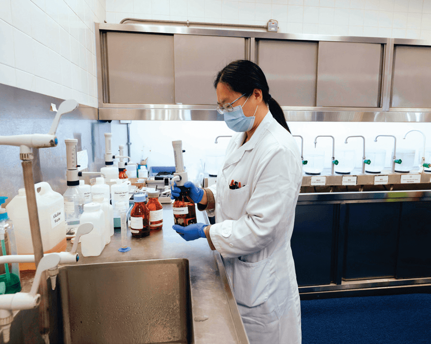 Laboratory staff conducting tests on water samples