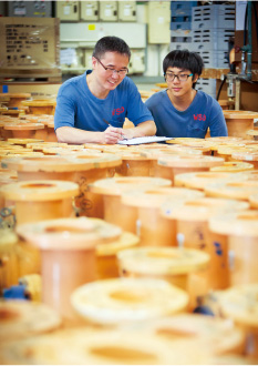 Worker teaches student Photo