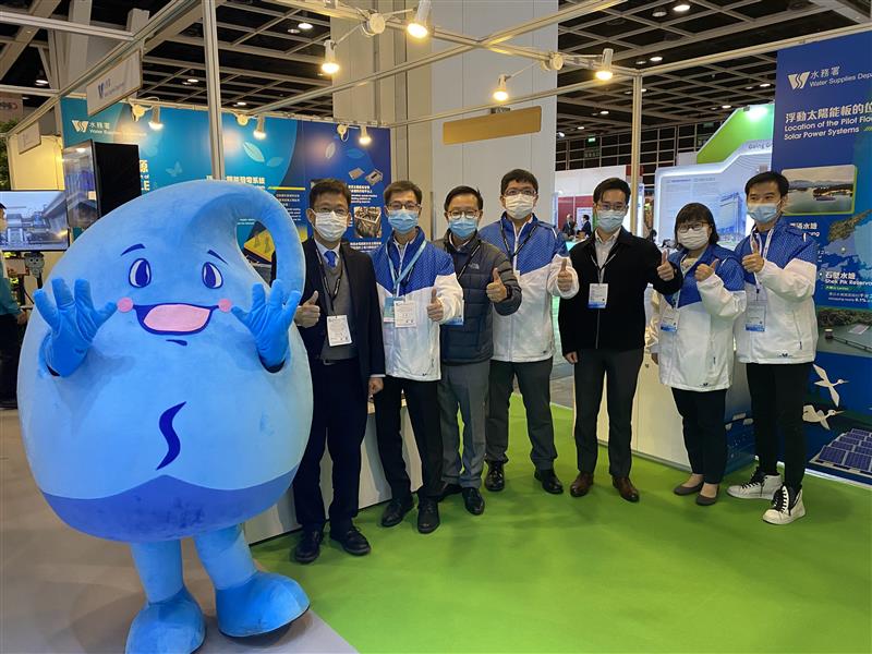 WSD staff and Water Save Dave pictured in front of the exhibition booth.