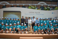 Participant representatives and guests on the stage