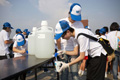Taking water sample for tests